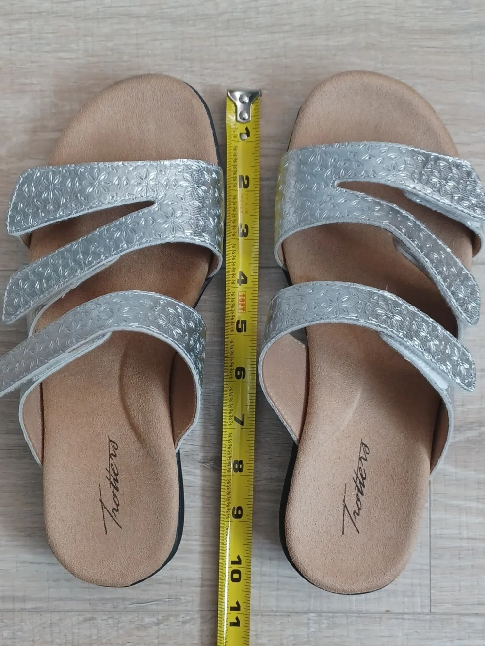 9W Trotters silver sandals. Slip on shoes with adjustable Velcro straps.